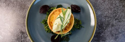 A tart displayed on a plate.