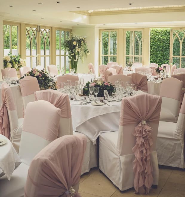 Tables laid ready for a wedding.
