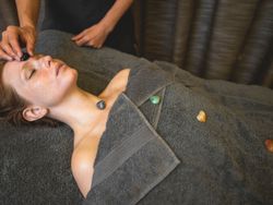 Facial massage using chakra crystals