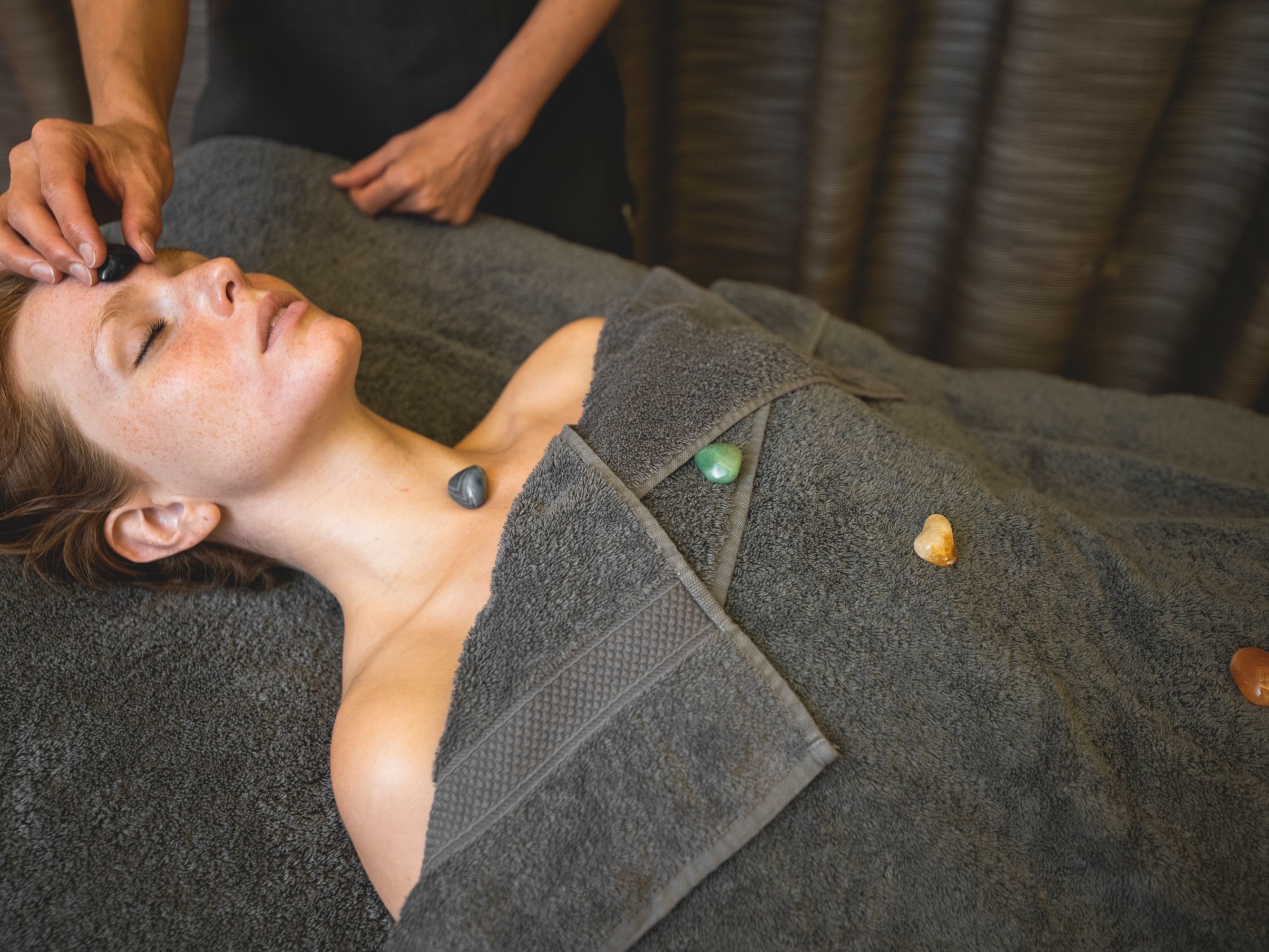 Facial massage using chakra crystals