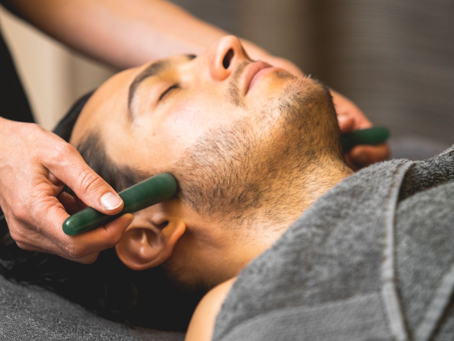 A facial using Jade Crystal wands