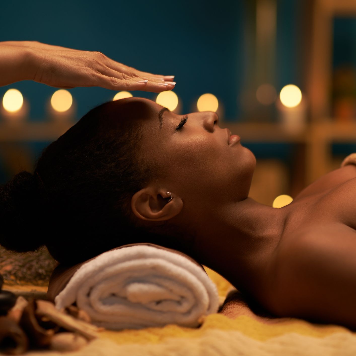 Woman receiving a reiki session