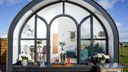 Glamping pod with wellies on doorstep