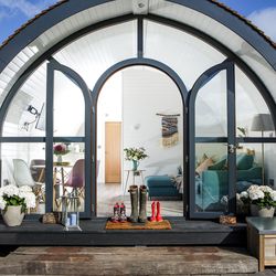 Glamping pod with wellies on doorstep