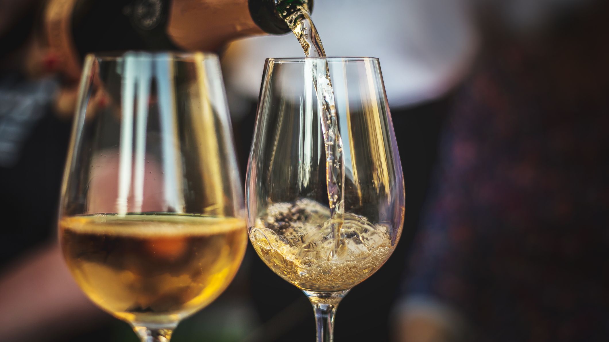 White wine poured into glasses