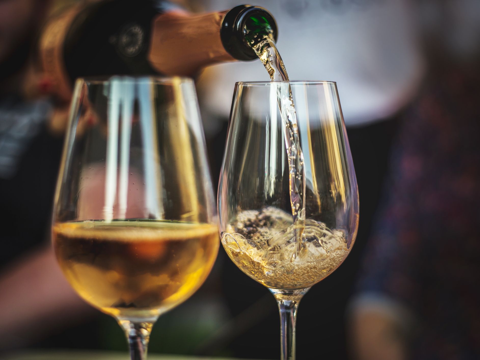 White wine poured into glasses