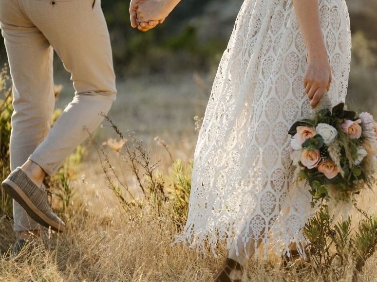 Outdoor wedding scenes including a couple holding hands, a bridal bouquet, and a scenic venue with cabins at sunset.