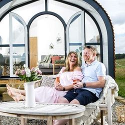 Couple sat outside Heather Pod