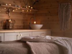 Spa treatment room with fairy lights in background