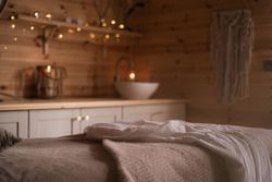 Spa treatment room with fairy lights in background