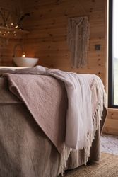 Blankets on bed in spa treatment room