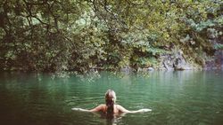 Person in natural water pool