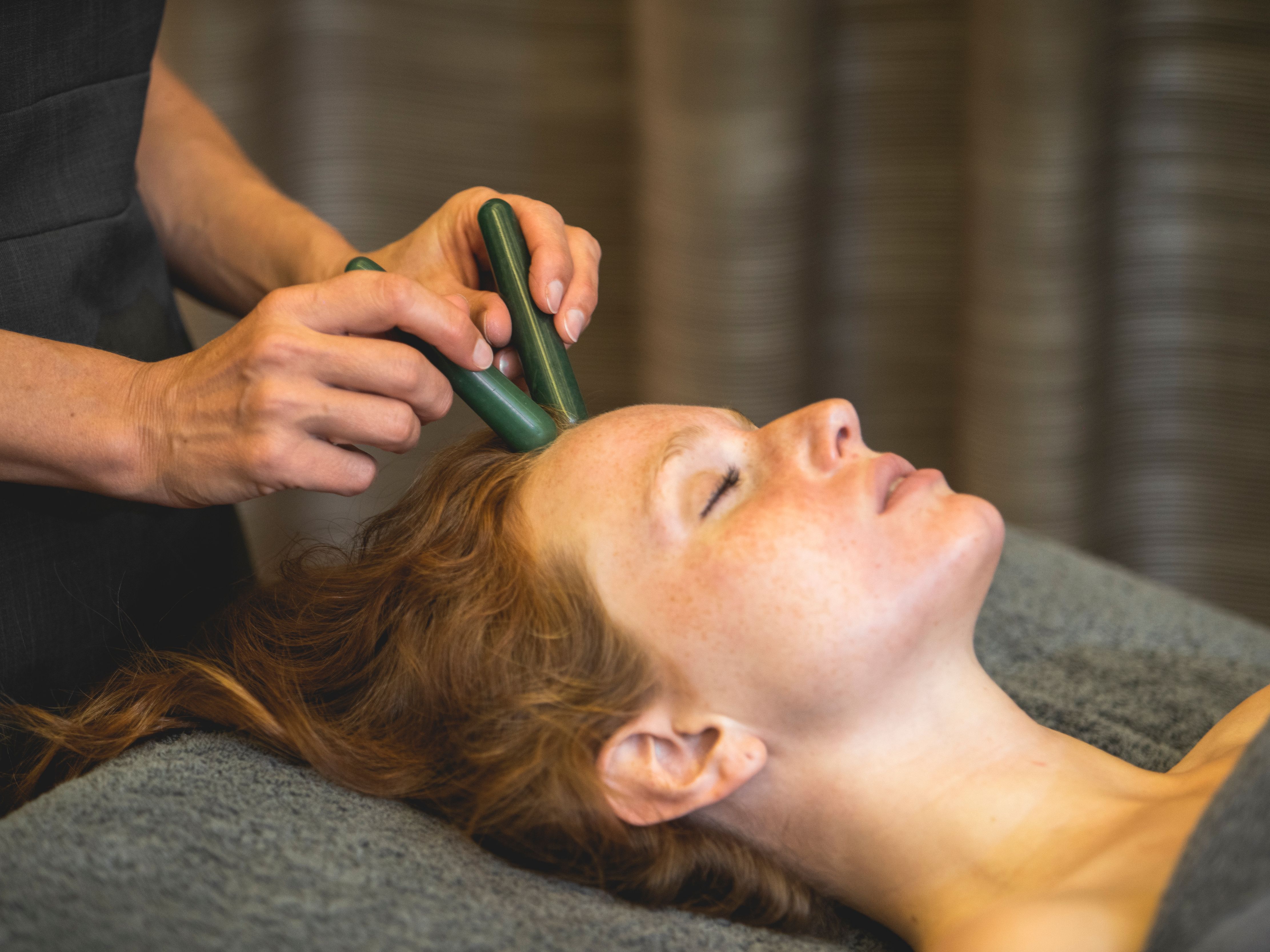 Facial using Jade crystal wands
