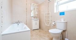 hirwaun cottage bathroom with bath and freestanding shower