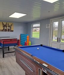 games room with table football and pool table