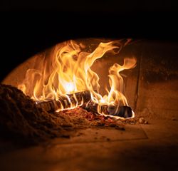 Fire burning in oven poco pizza