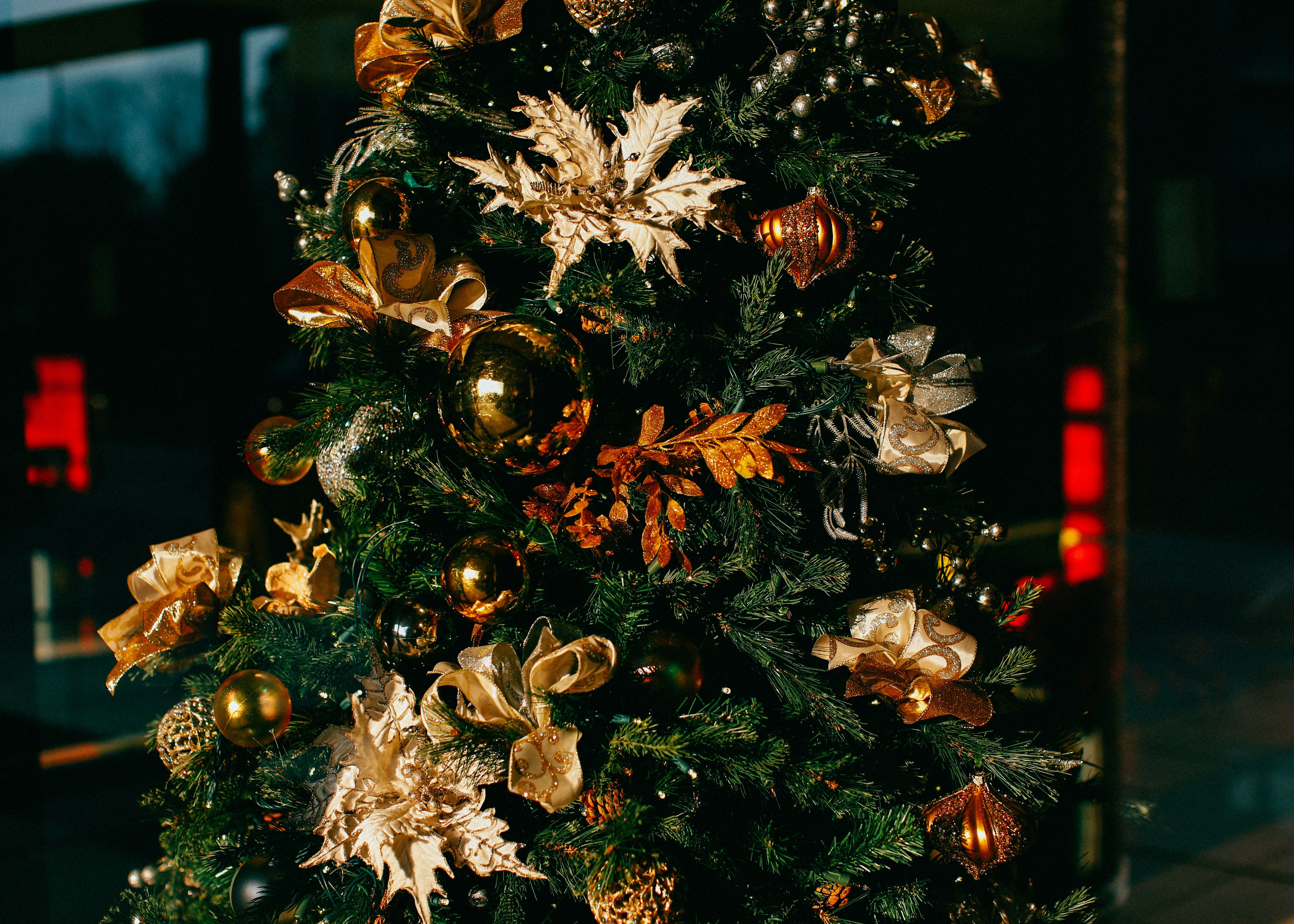 Decorated Christmas tree with gold and bronze ornaments and ribbons