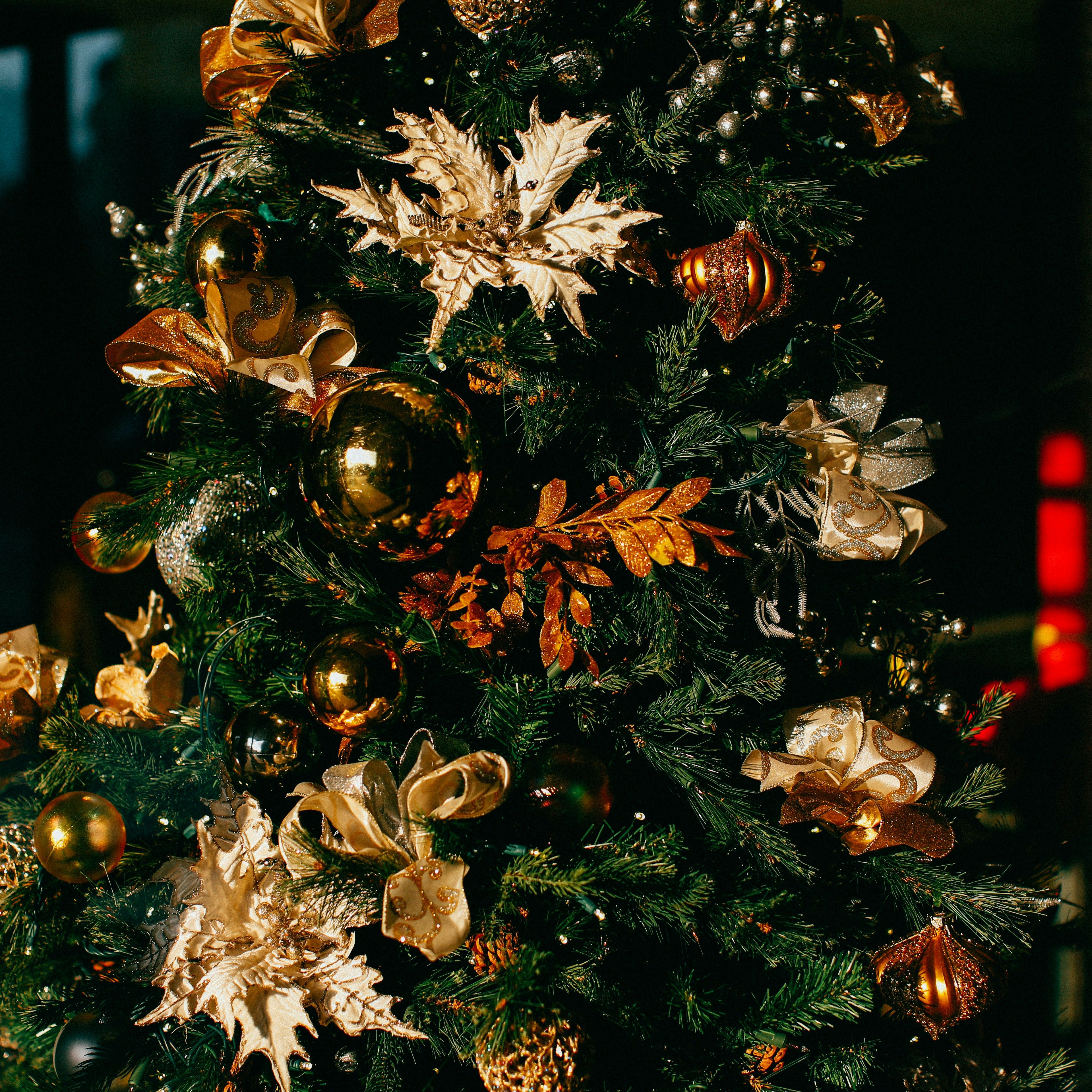 Decorated Christmas tree with gold and bronze ornaments and ribbons