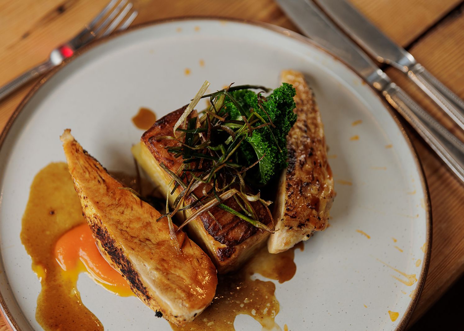 Gourmet chicken breast with vegetables and sauce on a plate