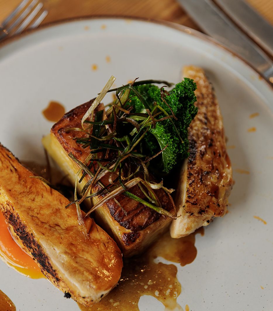 Gourmet chicken breast with vegetables and sauce on a plate