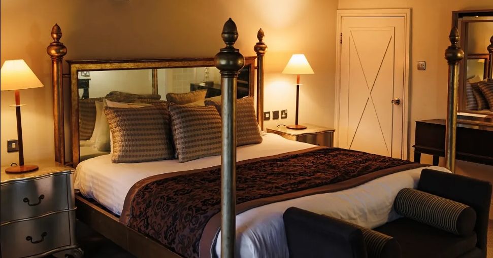 Luxurious bedroom with four-poster bed and elegant decor