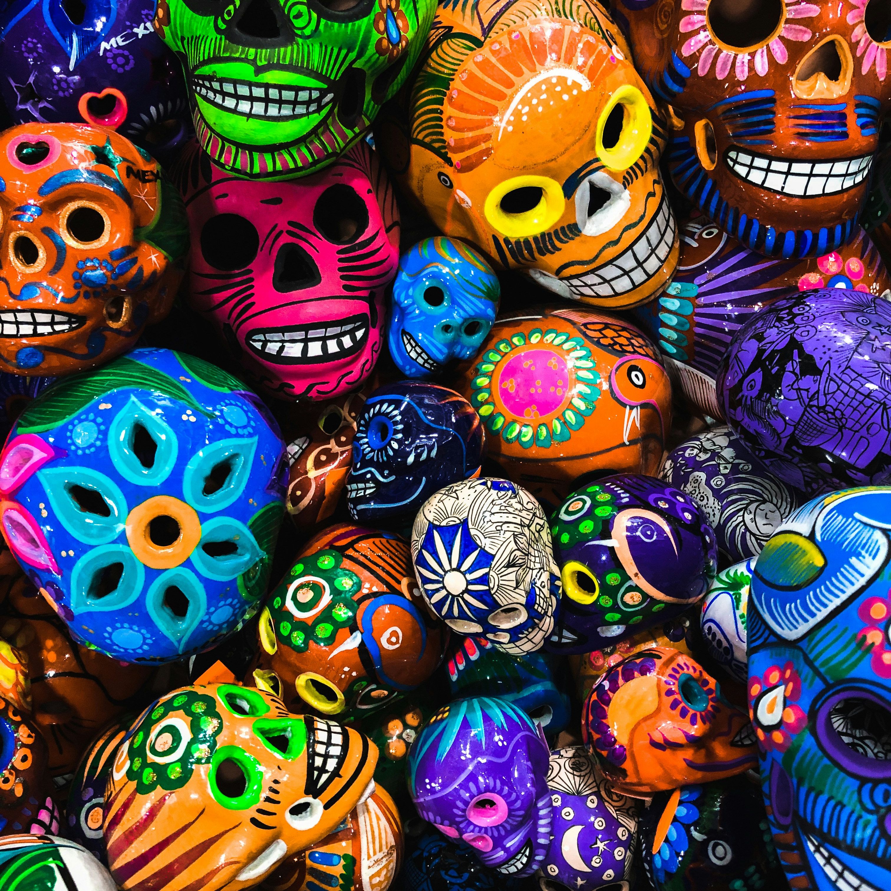 Colorful Day of the Dead skulls in various sizes and patterns