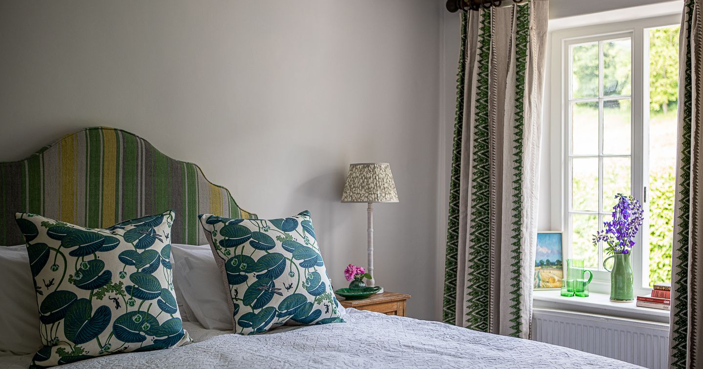 Cozy bedroom with green accents and floral decor