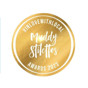 Muddy Stilettos Awards 2023 gold badge with #INLOVEWITHLOCAL at the top