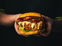 Chef holding burger