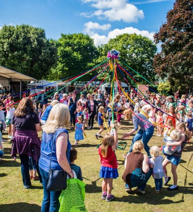Maypole dancing at Blackmore Gardens during Sidmouth Folk Festival
