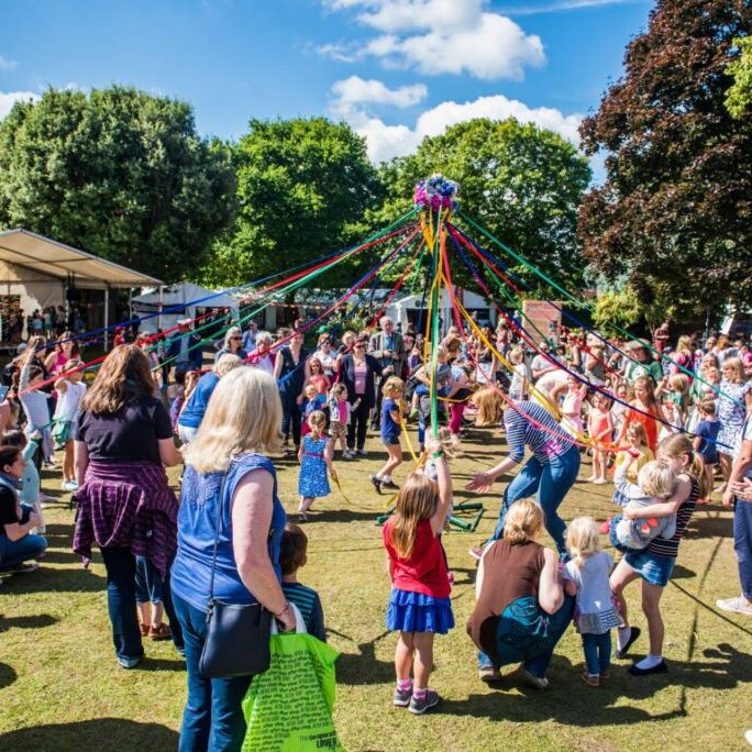 Maypole dancing at Blackmore Gardens during Sidmouth Folk Festival