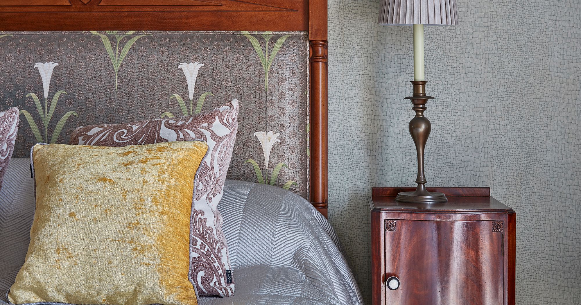 Bedside table and corner of bed