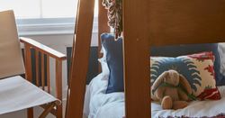 Set of Bunk-beds and a chair in a room