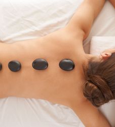 Lady Having Hot Stone Spa Treatment