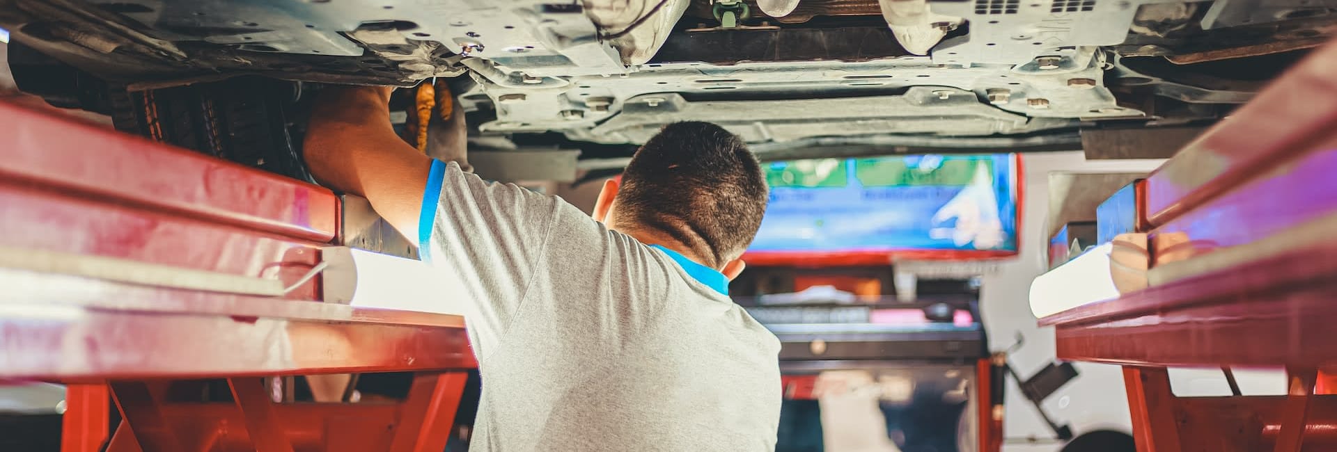 Mechanic under car