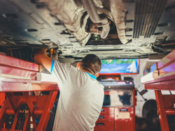 Mechanic under car