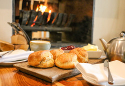 Winter cream tea in front of the South Sands fire