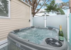 Outdoor hot tub with champagne and glasses