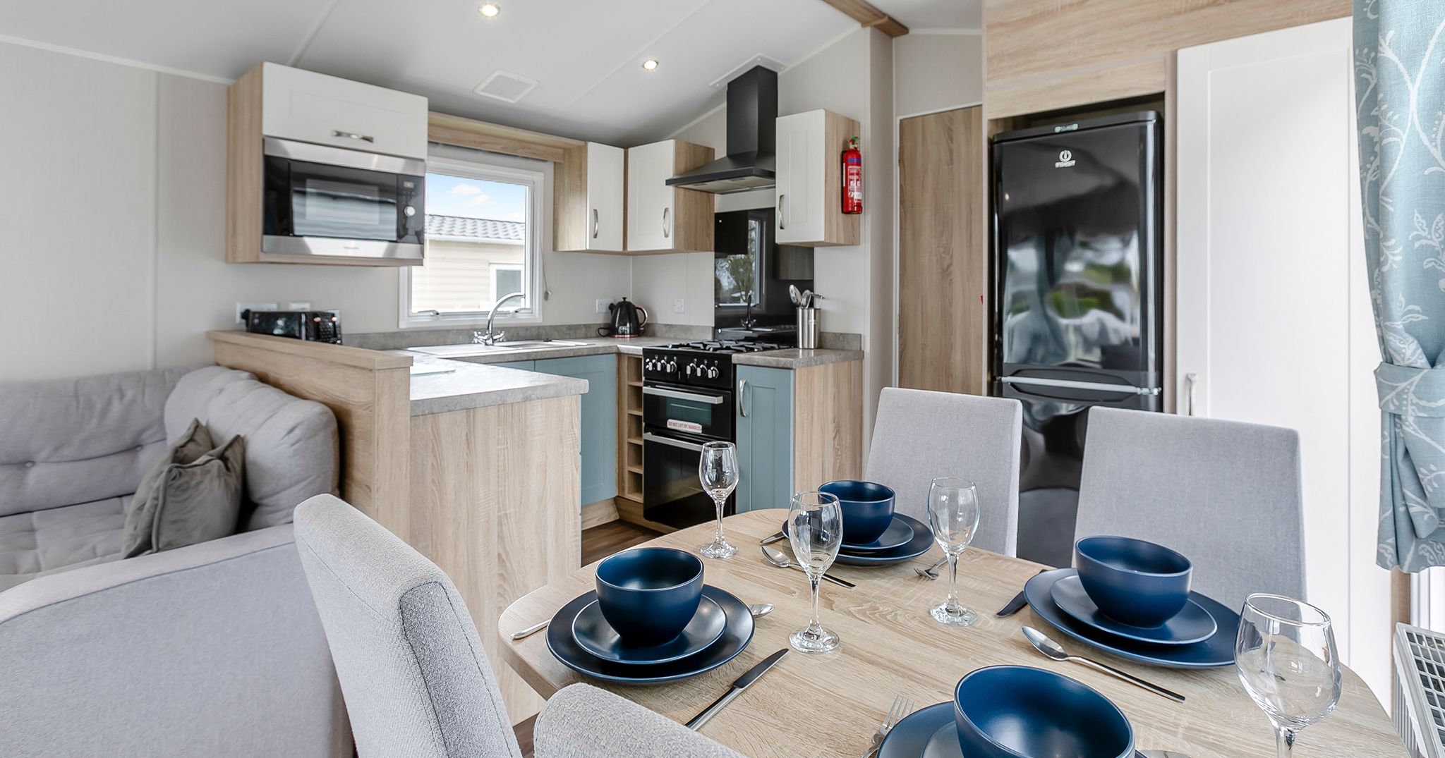 Modern open-plan kitchen and dining area inside a cozy home.