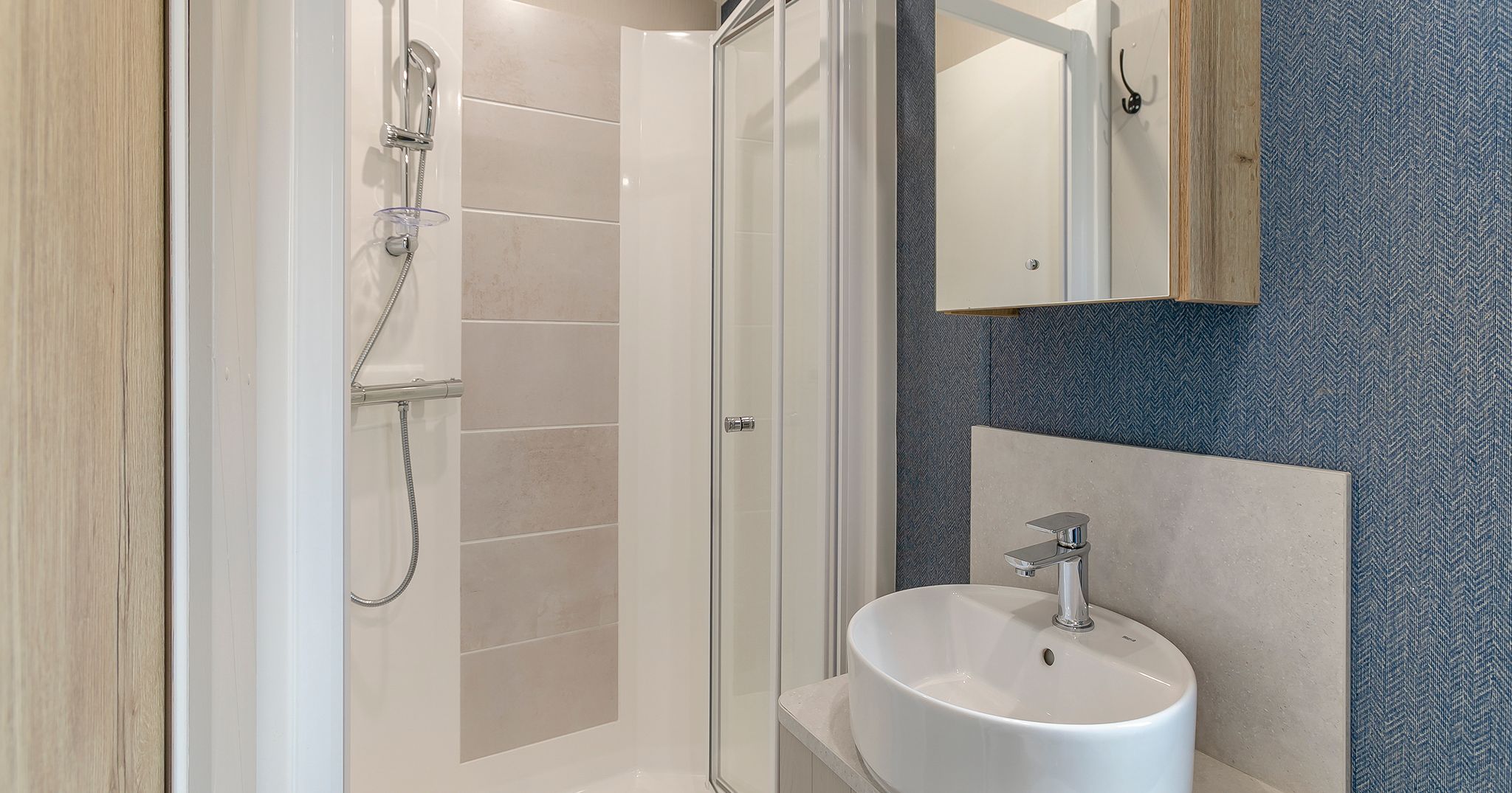 Modern bathroom with a shower and a round sink