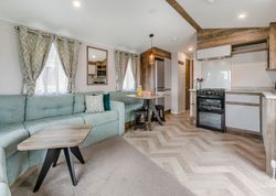 Modern open-plan living area and kitchen in a mobile home or holiday lodge