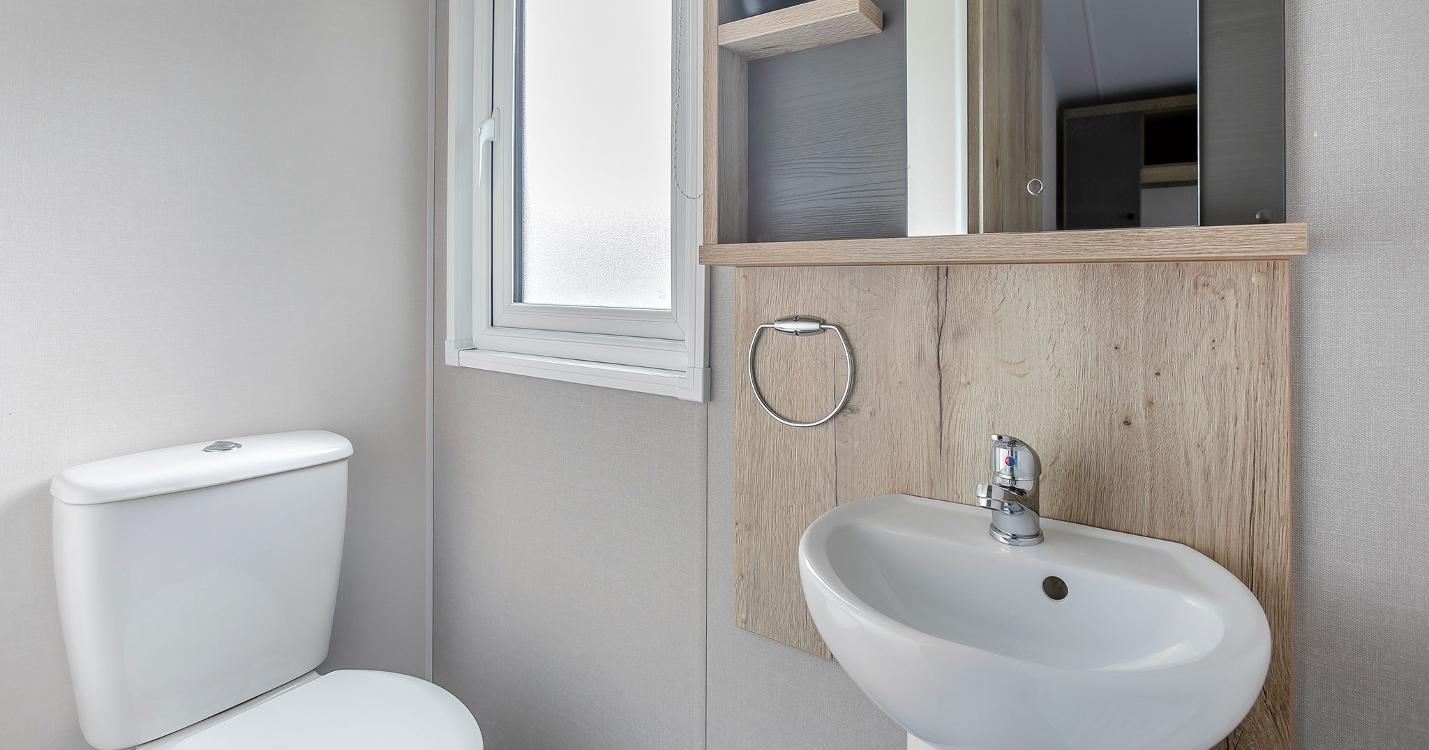 Modern small bathroom with toilet and sink