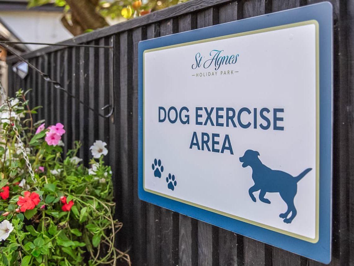 Sign for dog exercise area at St Agnes Holiday Park