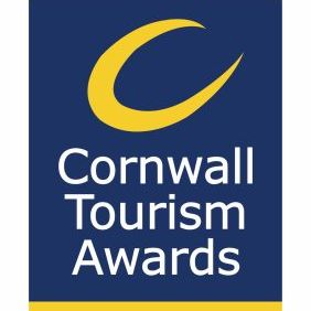 Cornwall Tourism Awards logo with a yellow curved line above the text