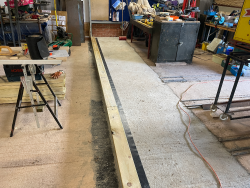 The workshop floor extension in place with the start being made on the partition wall.
