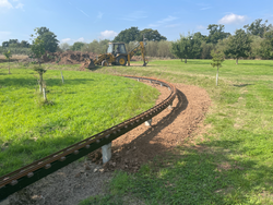 19/09/2024  The ground level around part of the raised track being raised using spare topsoil.
