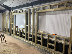 07/11/2024 The framework for the meeting room wall erected.