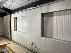 14/11/2024 The insulation and plasterboard installed on the meeting room wall.