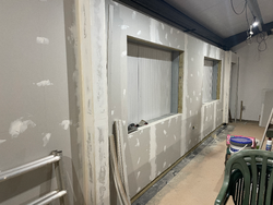 28/11/2024 The south wall of the meeting room with the joints filled on the plasterboard awaiting rubbing down.