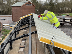 13/03/2025  the roof cladding being installed on the ground level carriage shed.